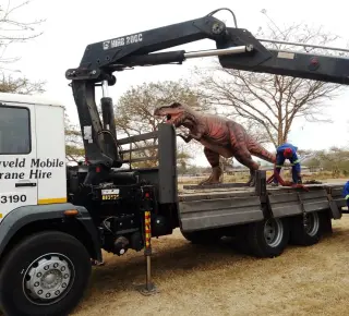 Picture of a dinosaur being loaded onto the HIAB truck