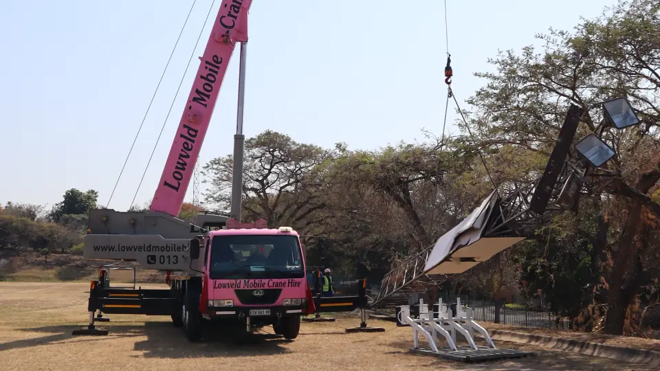 Picture of the Pink Lady crane lifting a stadium light