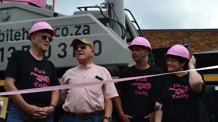 The family that owns Lowveld Mobile Crane Hire standing in front of the Pink Lady crane on the day of its launch