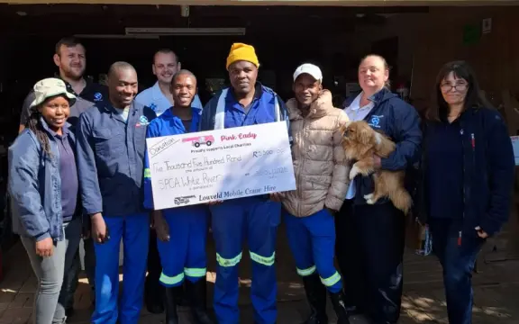 LMCH personnel with White River SPCA members as they recieve their donation of R5 000
